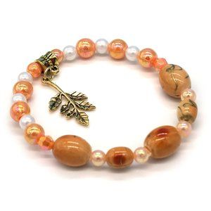 Bracelet Pearls Orange Peach Beads Amber Tones Antiqued Gold Leaf Charm. OS.